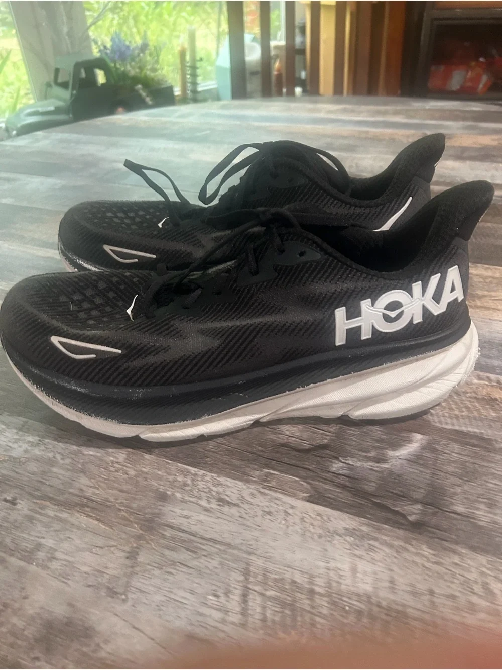 Men's size 11.5D Hoka Black and White Road Running Shoes